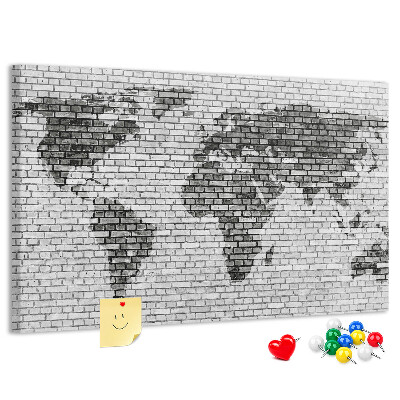 Wereldkaart op een bakstenen muur prikbord
