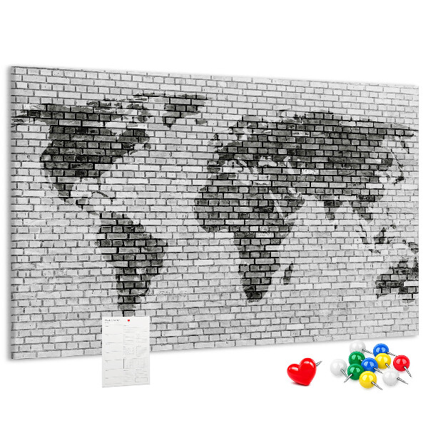 Wereldkaart op een bakstenen muur prikbord