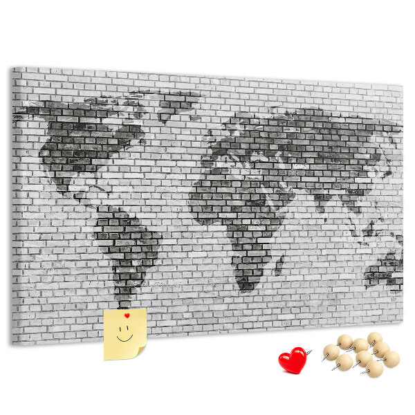 Wereldkaart op een bakstenen muur prikbord