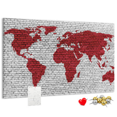 Kurkbord met afbeelding van de wereld op een bakstenen muur