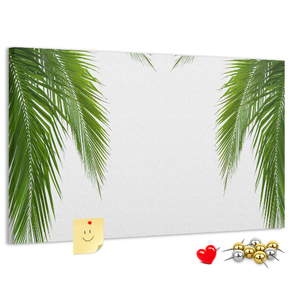 Prikbord met een print van palmbladeren op een witte achtergrond