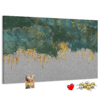 Prikbord met gouden druppels op een blauwe wolkenachtergrond