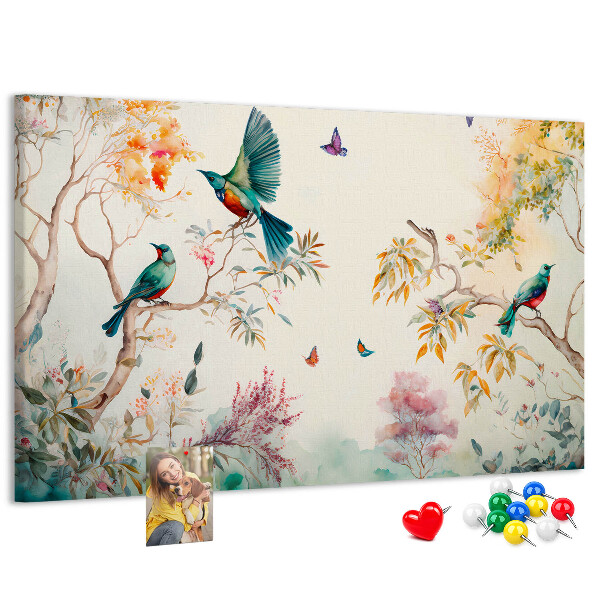 Prikbord met een afbeelding van kleurrijke vogels in een lentelandschap