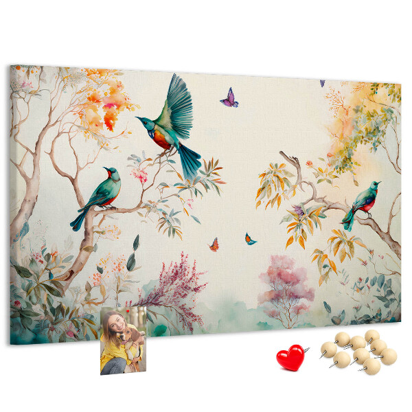 Prikbord met een afbeelding van kleurrijke vogels in een lentelandschap