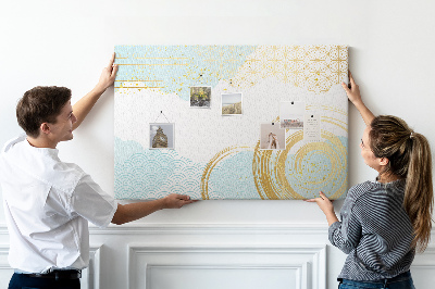 Prikbord met gouden spiralen op een blauwe achtergrond