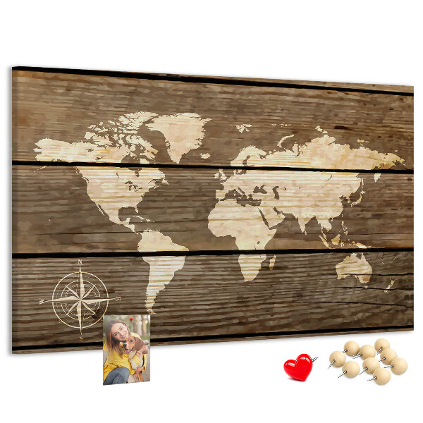 Prikbord wereldkaart op een achtergrond van houten planken