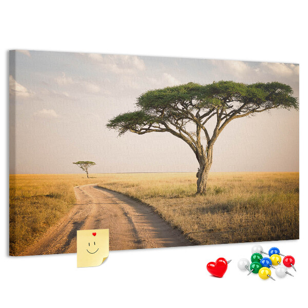 Prikbord met een Afrikaans landschap van een weg met een boom