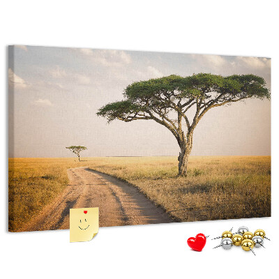 Prikbord met een Afrikaans landschap van een weg met een boom