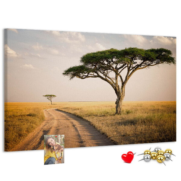 Prikbord met een Afrikaans landschap van een weg met een boom