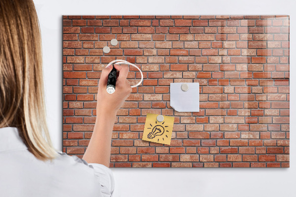 Memobord van glas met print inclusief neodymium magneten Een prikbord aan een bakstenen muur