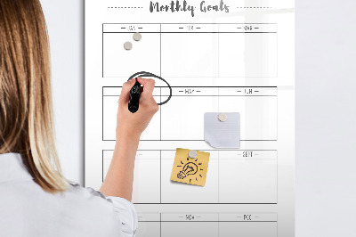 Decoratief glazen wandbord beschrijfbaar en magnetisch Maandelijkse doelen met de mogelijkheid om ze te personaliseren.
