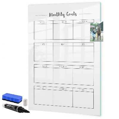 Decoratief glazen wandbord beschrijfbaar en magnetisch Maandelijkse doelen met de mogelijkheid om ze te personaliseren.