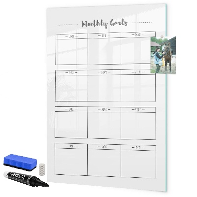 Decoratief glazen wandbord beschrijfbaar en magnetisch Maandelijkse doelen met de mogelijkheid om ze te personaliseren.