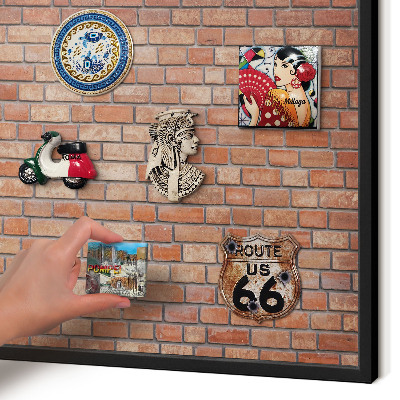 Wandbord voor magneten in een zwarte lijst Bakstenen muur