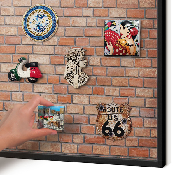 Wandbord voor magneten in een zwarte lijst Bakstenen muur