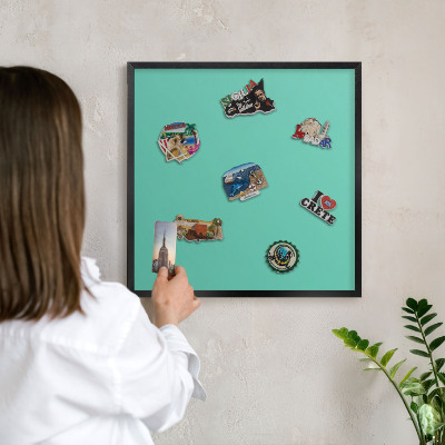 Wandbord voor magneten in een zwarte lijst Sterke munt