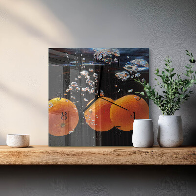 Vierkante glazen wandklok sinaasappels