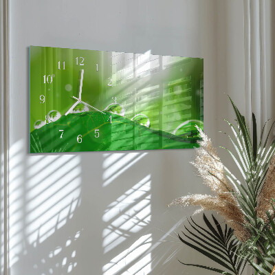 Glazen wandklok rechthoekig Dauw op een blad